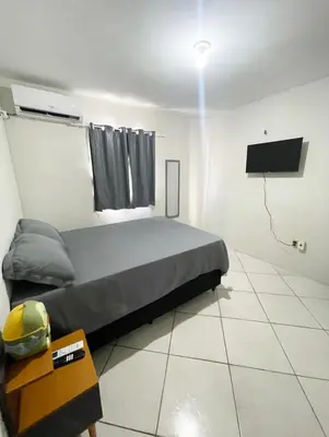 Uma cama ou camas num quarto em Apartamento completo e central! Casa Caju!