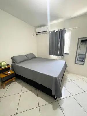 Uma cama ou camas num quarto em Apartamento completo e central! Casa Caju!