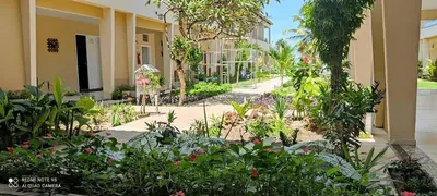 Um jardim no exterior de Pousada Itarema Residence