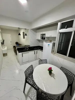 A cozinha ou kitchenette de Flat a uma quadra da praia