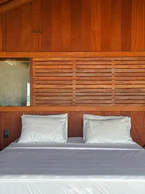 Uma cama ou camas num quarto em Vila Moitas Casa TUPI