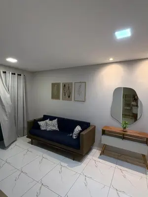 Uma área de estar em Casa da Maré Pé na areia Suítes climatizadas e deck vista mar