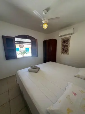Uma cama ou camas num quarto em Pousada Villa do Sol Taiba