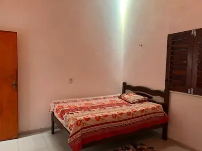 Uma cama ou camas num quarto em Casa de praia em Mundaú