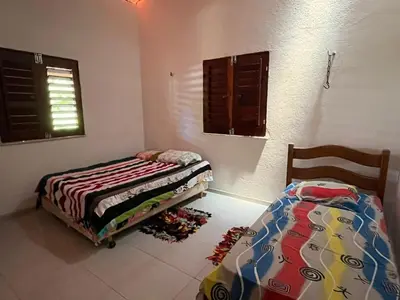 Uma cama ou camas num quarto em Casa de praia em Mundaú