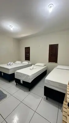 Uma cama ou camas num quarto em Garden Flat Beach - 102