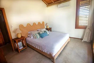 Uma cama ou camas num quarto em Family and Kitesurfing Paradise by the Sea