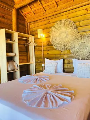 Uma cama ou camas num quarto em Chalet Paraiso Canoa 3 na praia - Canoa Quebrada