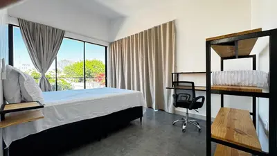 Uma cama ou camas num quarto em Chalés da Bica - Modernidade e Aconchego a 100m da Praia