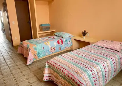 Uma cama ou camas num quarto em Casa de Praia Cascavel
