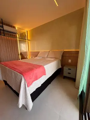 Uma cama ou camas num quarto em Studio 1412 próximo à Beira-Mar de Fortaleza-Ce