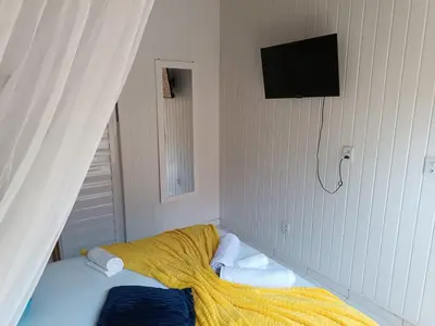 Uma cama ou camas num quarto em Blue Sapphire guest house