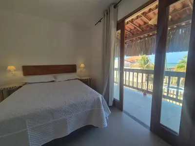 Uma cama ou camas num quarto em Pousada Janela dos Ventos