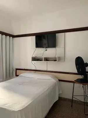 Uma cama ou camas num quarto em Flat Villa Costeira - Vista Lateral Mar