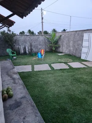 Um jardim no exterior de Casa por do sol Flecheiras
