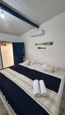 Uma cama ou camas num quarto em Suite Canoa Azul 2