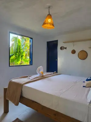 Uma cama ou camas num quarto em Chez Tata - Icaraí Kite Village