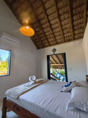 Uma cama ou camas num quarto em Chez Tata - Icaraí Kite Village