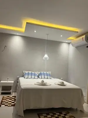 Uma cama ou camas num quarto em Paraíso da Barra House