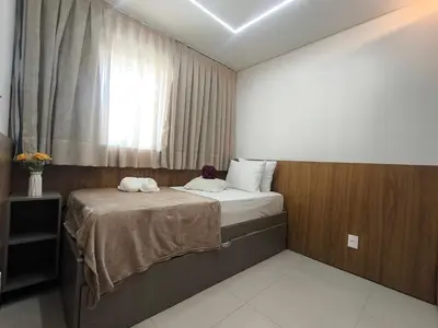 Uma cama ou camas num quarto em Apto 2 quartos luxuoso a poucos metros da Beira Mar