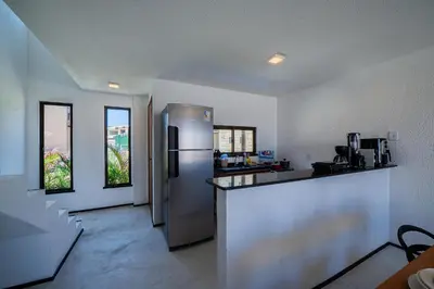 A cozinha ou kitchenette de Beachfront Duplex Pé na Areia By Carpediem