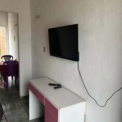 Uma televisão e/ou sistema de entretenimento em Apartamento Sunset Canindé