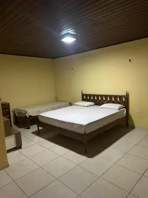 Uma cama ou camas num quarto em Casa fazenda Paracuru