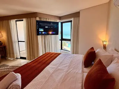 Uma cama ou camas num quarto em O melhor da Beira Mar de Fortaleza