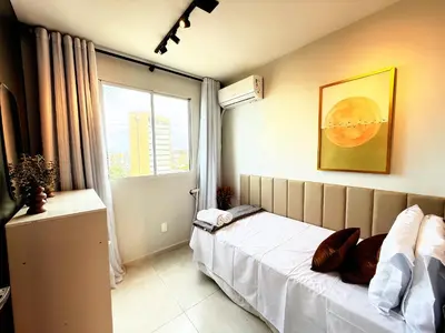 Uma cama ou camas num quarto em Hosts BR - Apartamentos Econômicos na Praia do Futuro