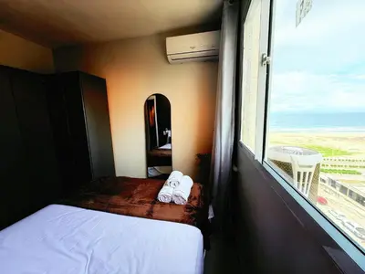 Uma cama ou camas num quarto em Hosts BR - Apartamentos Econômicos na Praia do Futuro