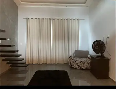 Uma área de estar em Loft Moderno Aconchegante e Confortável