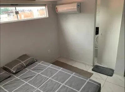 Uma cama ou camas num quarto em Loft Moderno Aconchegante e Confortável