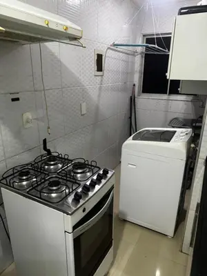 A cozinha ou kitchenette de Apartamento totalmente mobiliado