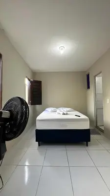 Uma cama ou camas num quarto em Garden Flat Beach - 202