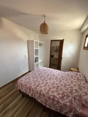 Uma cama ou camas num quarto em Cozy Condo Preá Beira-mar