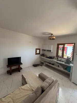 Uma televisão e/ou sistema de entretenimento em Cozy Condo Preá Beira-mar