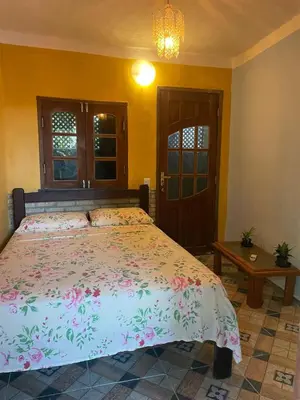 Uma cama ou camas num quarto em Casa Maria Bonita