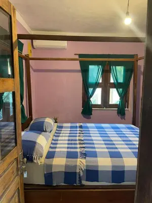 Uma cama ou camas num quarto em Casa Maria Bonita