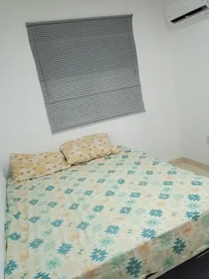 Uma cama ou camas num quarto em Condomínio tropicaliente
