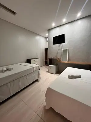 Uma cama ou camas num quarto em Quarto triplo