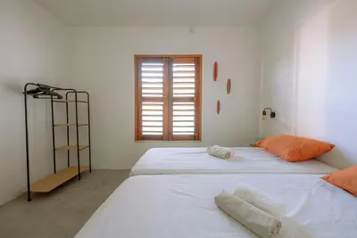 Uma cama ou camas num quarto em Casa Iguana