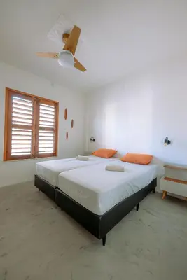 Uma cama ou camas num quarto em Casa Iguana