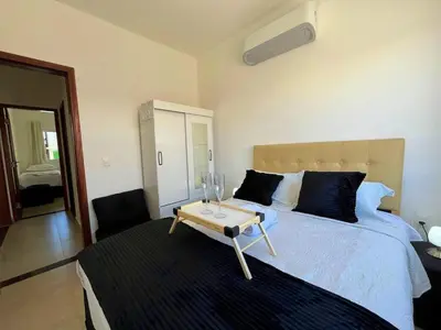 Uma cama ou camas num quarto em Canoa quebrada - Apartamento a 4 minutos da Praia