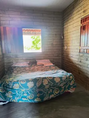Uma cama ou camas num quarto em Abrigo de Montanha Quixadá