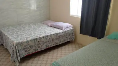 Uma cama ou camas num quarto em capongabeachce