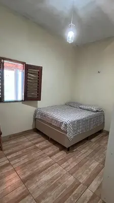 Uma cama ou camas num quarto em Encanto de paracuru