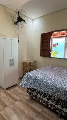 Uma cama ou camas num quarto em Encanto de paracuru