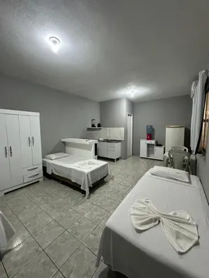 Uma cama ou camas num quarto em Residencial Dumont