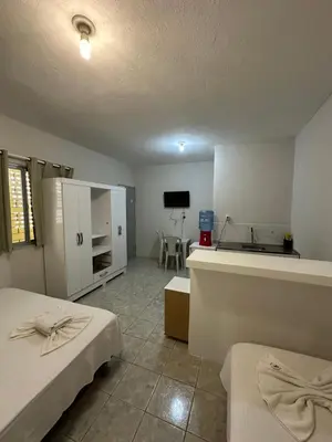 Uma cama ou camas num quarto em Residencial Dumont