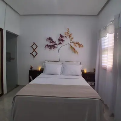 Uma cama ou camas num quarto em Preá, Suíte Privativa próximo ao Parque Nacional de Jeri